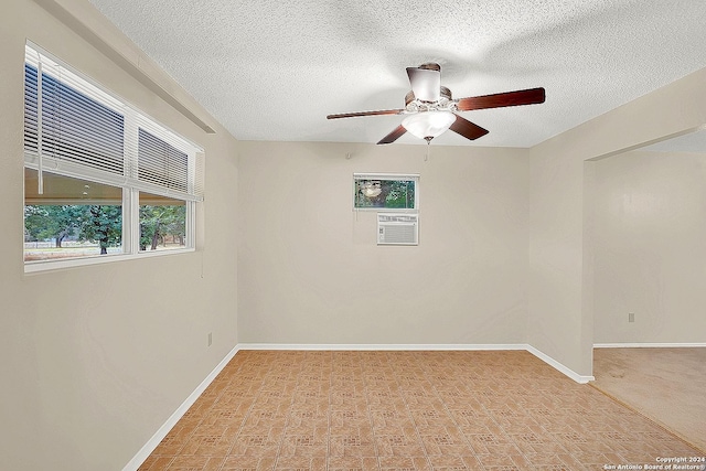 spare room with ceiling fan and a textured ceiling