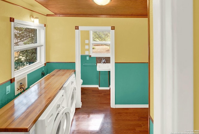 interior space featuring washer / dryer, sink, wooden ceiling, and wood-type flooring