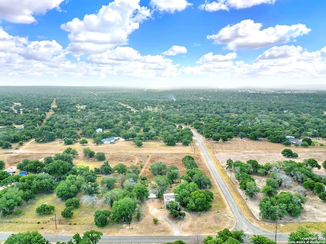 birds eye view of property featuring a rural view