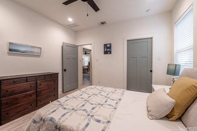 bedroom featuring light wood-type flooring and ceiling fan