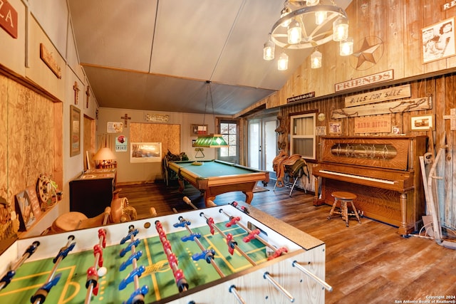 game room featuring pool table, wood-type flooring, wooden walls, and vaulted ceiling