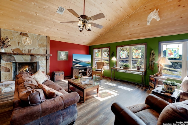 living room with hardwood / wood-style flooring, a fireplace, high vaulted ceiling, and a healthy amount of sunlight