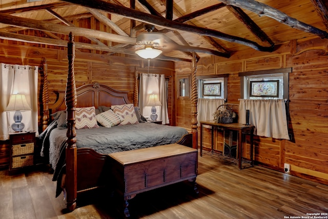 bedroom with hardwood / wood-style floors, wooden ceiling, and wooden walls