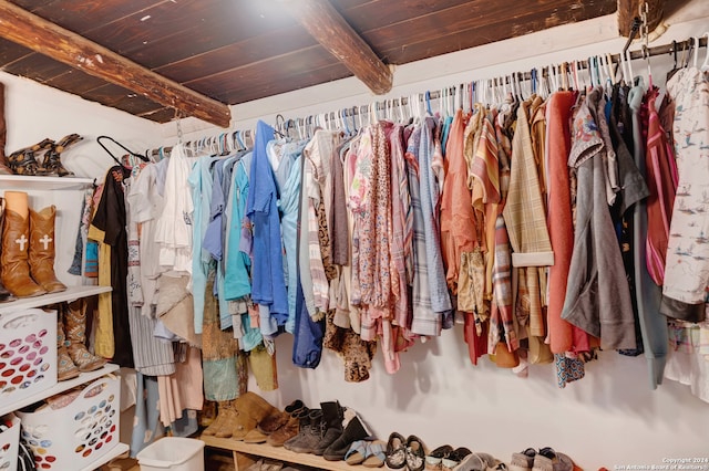 spacious closet featuring beamed ceiling