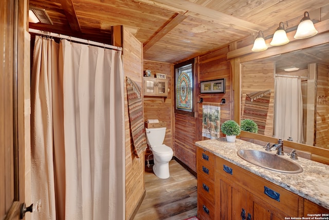 bathroom featuring toilet, hardwood / wood-style floors, wood ceiling, and wood walls