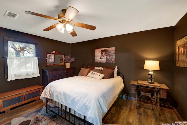 bedroom featuring dark wood-type flooring and ceiling fan