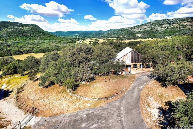 birds eye view of property with a mountain view