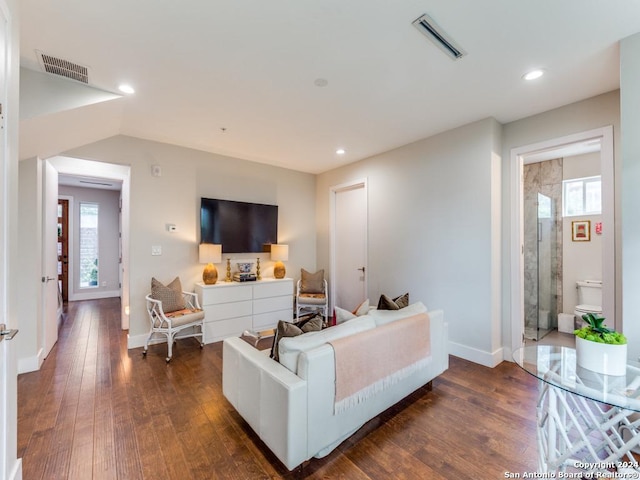 living room with dark hardwood / wood-style floors