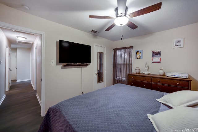 bedroom featuring ceiling fan and dark wood-type flooring