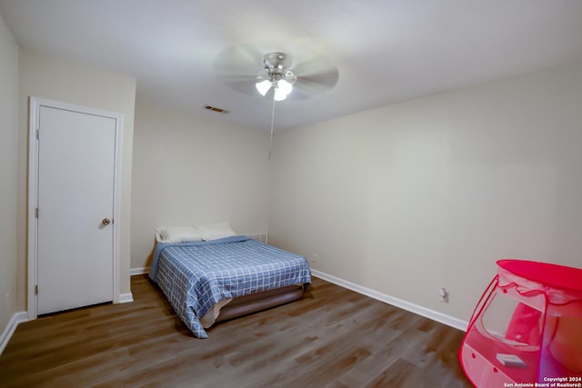 bedroom featuring wood-type flooring and ceiling fan