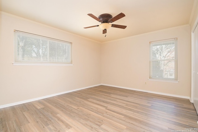 unfurnished room with ceiling fan, light hardwood / wood-style floors, and ornamental molding