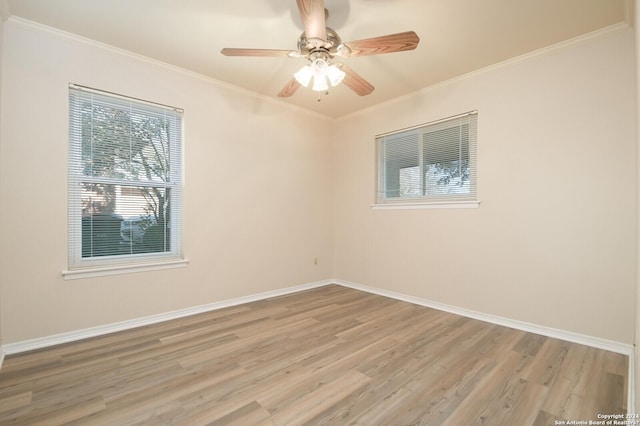 spare room with hardwood / wood-style flooring, ceiling fan, and ornamental molding