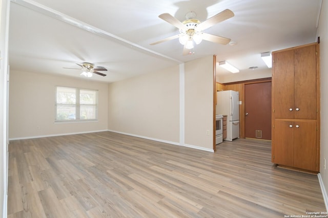 empty room featuring light wood-type flooring and ceiling fan