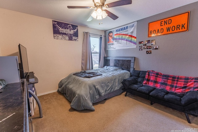 bedroom featuring ceiling fan and carpet