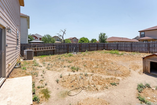 view of yard with central air condition unit