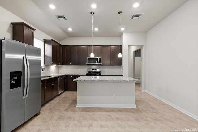 kitchen featuring dark brown cabinetry, light stone countertops, hanging light fixtures, stainless steel appliances, and a kitchen island