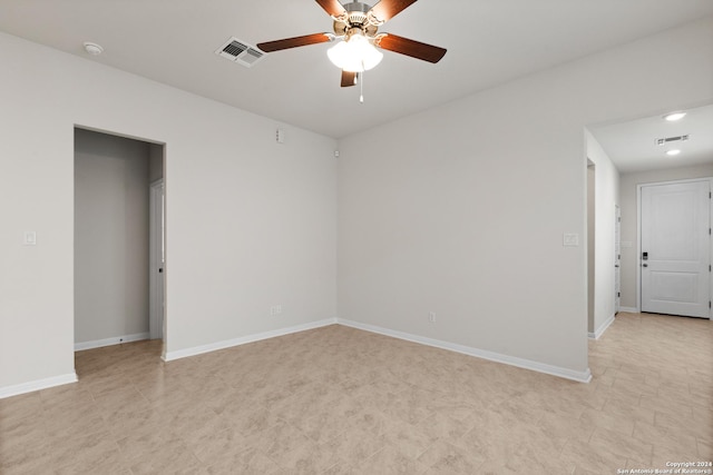 spare room with ceiling fan