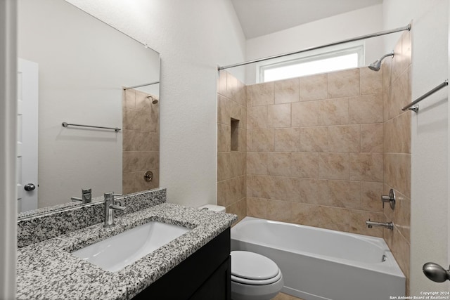 full bathroom with vanity, toilet, and tiled shower / bath