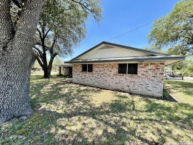 view of property exterior with a lawn