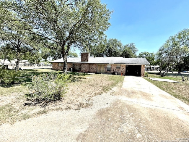 ranch-style house with a front lawn and a garage