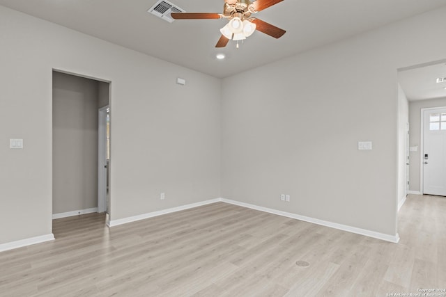 empty room featuring ceiling fan and light hardwood / wood-style floors