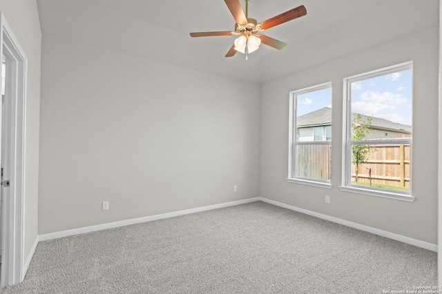 empty room with carpet and ceiling fan