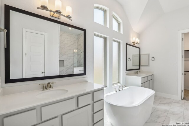 bathroom with lofted ceiling, plus walk in shower, and vanity