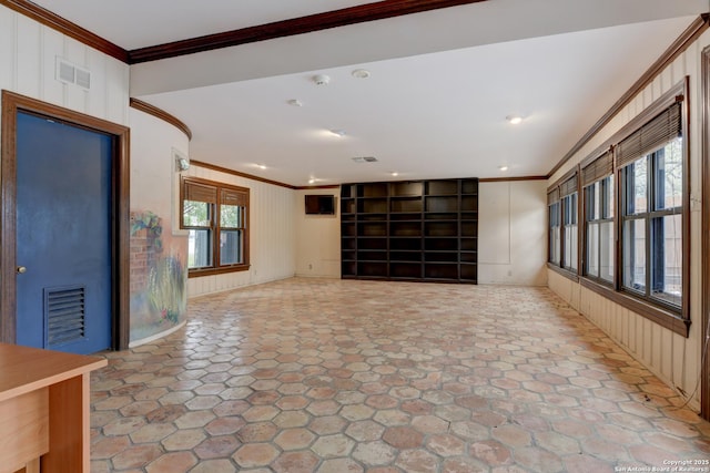 unfurnished living room featuring ornamental molding