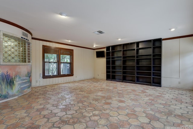 unfurnished room featuring crown molding