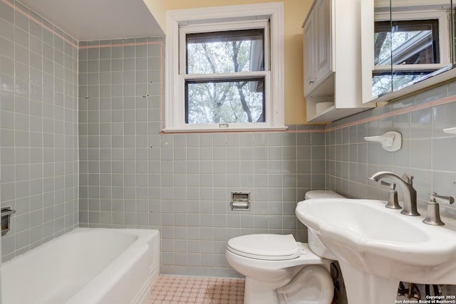 bathroom featuring sink, tile walls, toilet, and tile patterned flooring