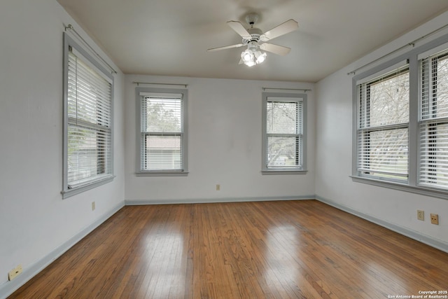 unfurnished room featuring hardwood / wood-style flooring and ceiling fan