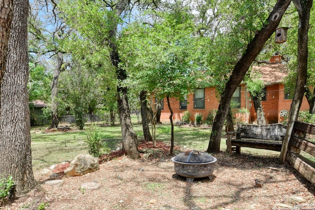 view of yard featuring a fire pit