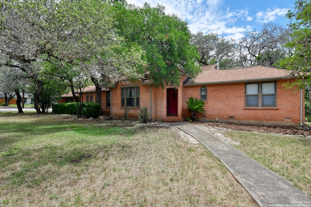 ranch-style house with a front lawn