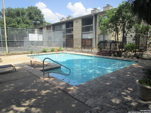 view of pool featuring a patio area