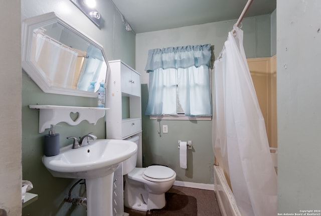 bathroom with shower / tub combo and toilet