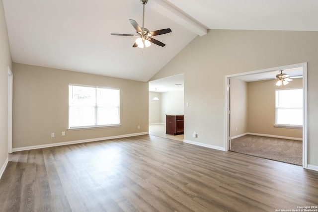 unfurnished living room with beamed ceiling, hardwood / wood-style floors, high vaulted ceiling, and ceiling fan