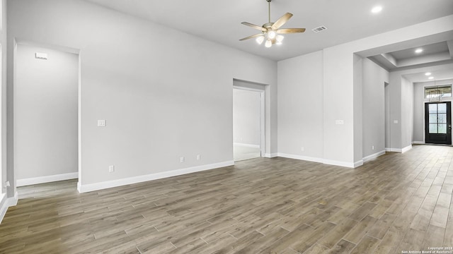 1716 Windward Way, Seguin, TX 78155 - unfurnished living room featuring wood finished floors, baseboards, ceiling fan, and recessed lighting