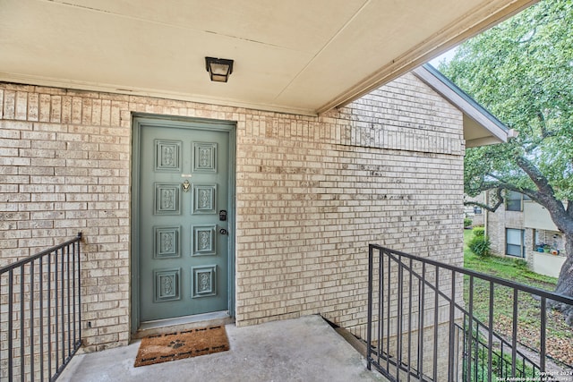 property entrance with a balcony