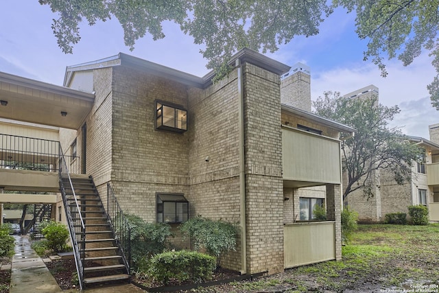 view of home's exterior featuring a balcony