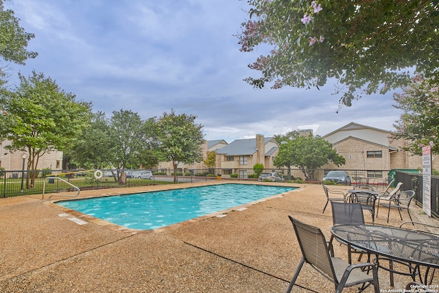 view of pool featuring a patio