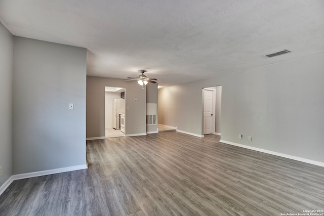 unfurnished room with hardwood / wood-style flooring, a textured ceiling, and ceiling fan