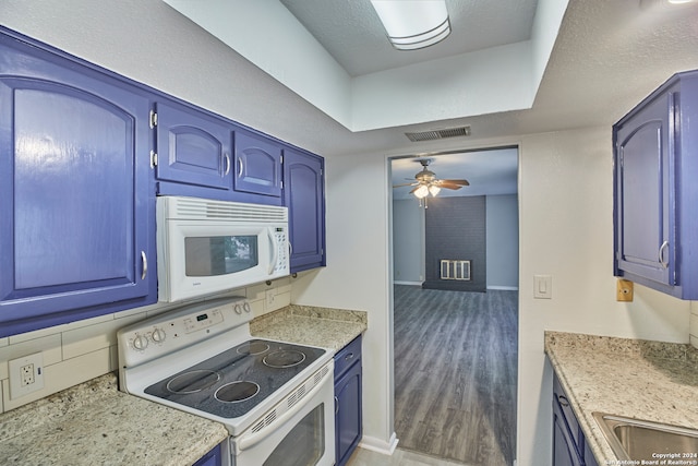 kitchen featuring sink, hardwood / wood-style flooring, white appliances, ceiling fan, and blue cabinetry