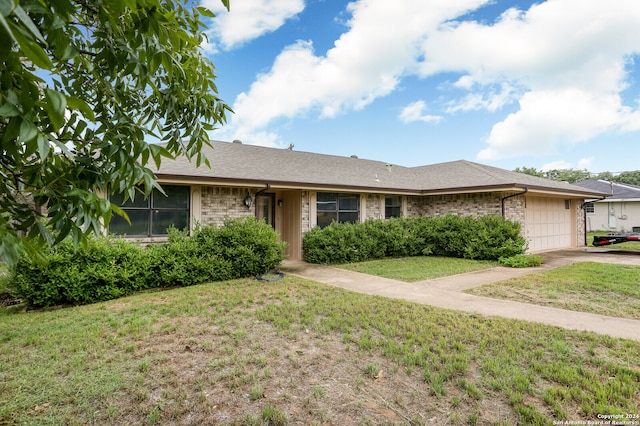 ranch-style house with a front lawn and a garage