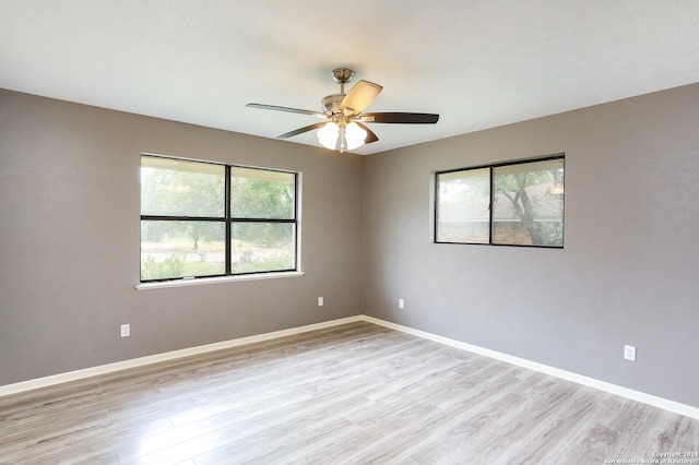 unfurnished room featuring ceiling fan and light hardwood / wood-style flooring