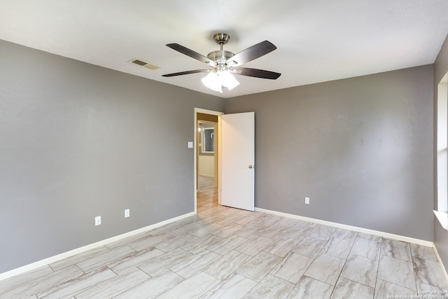 empty room featuring ceiling fan