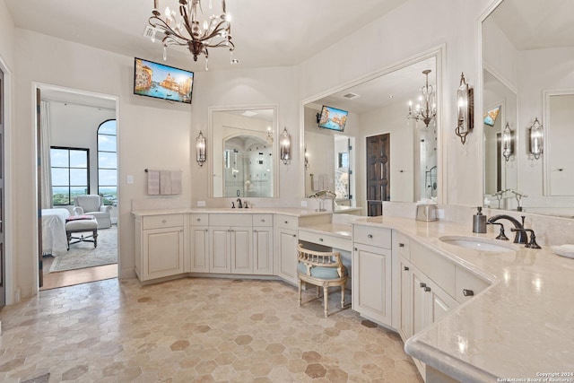 bathroom featuring vanity and an inviting chandelier