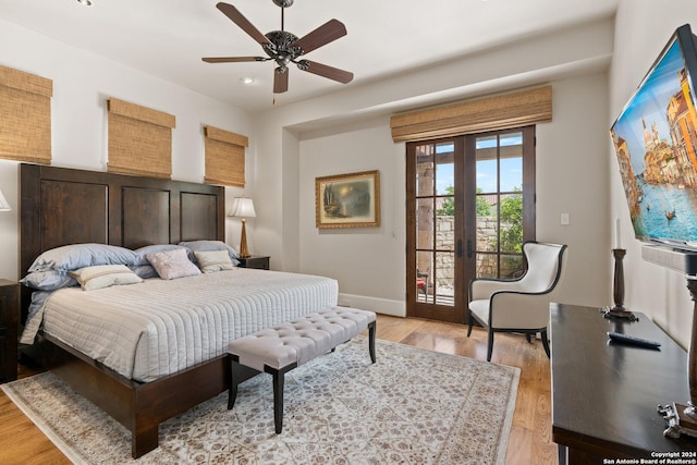 bedroom featuring ceiling fan, access to exterior, light wood-type flooring, and french doors