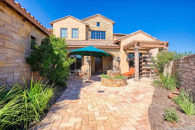 view of front of home with a patio area