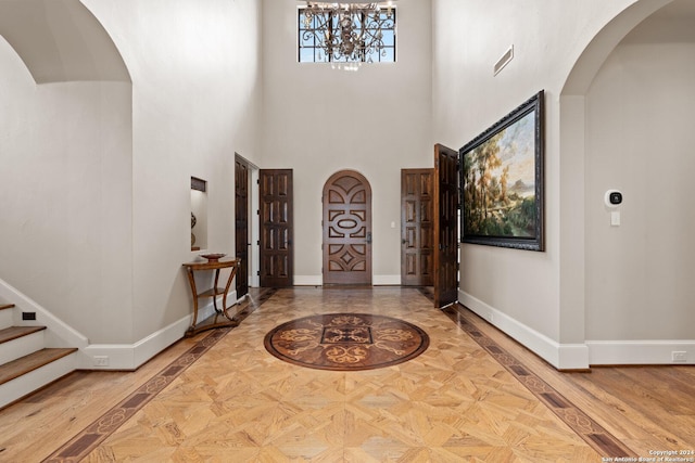 foyer entrance with a high ceiling