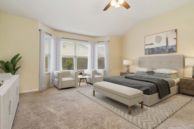 carpeted bedroom featuring vaulted ceiling and ceiling fan